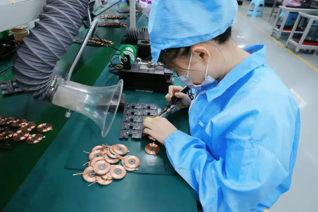 Soldering the coil on the PCBA